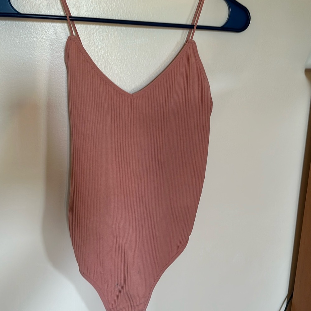 Pink ribbed body suit